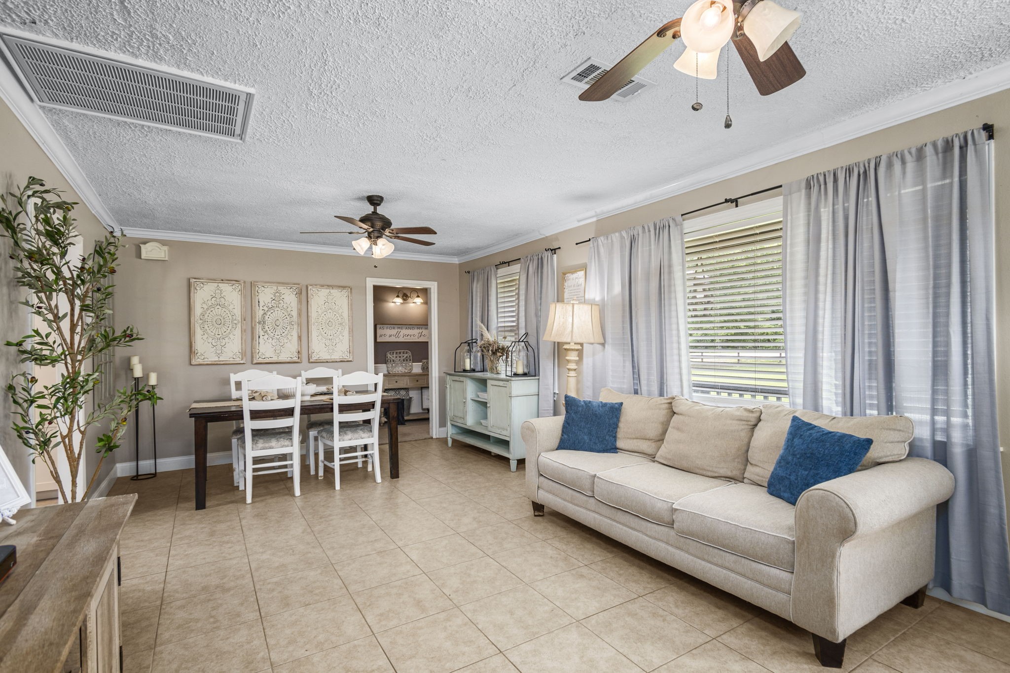25311 Hardin Store Road Pinehurst, TX 77362 - Photo 7 of 39 a living room with furniture and a large window