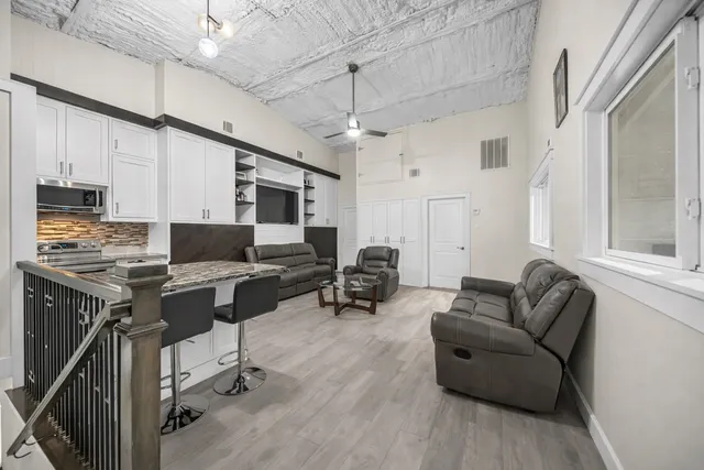 a bedroom with a bed and a dresser