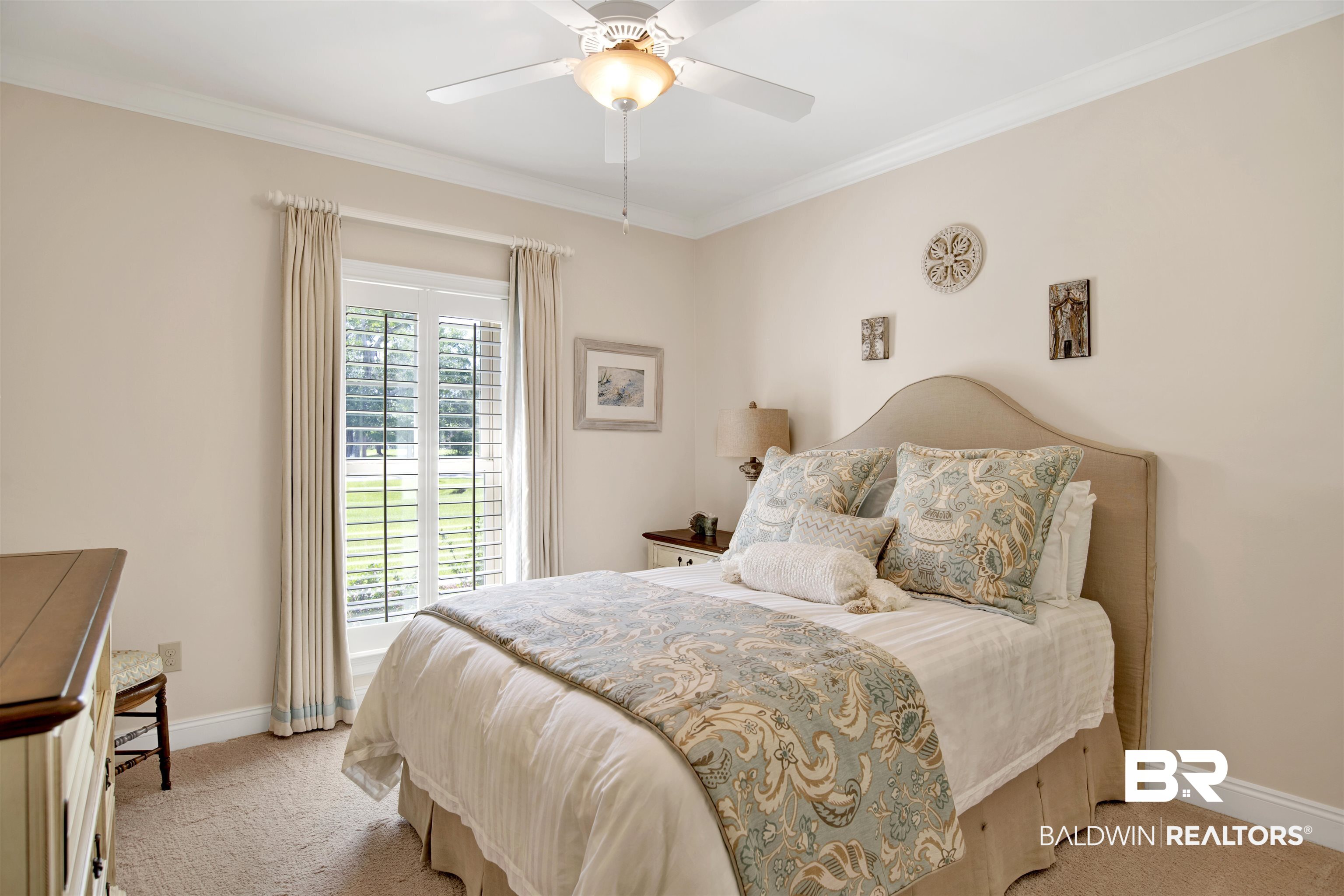 8358 Forest Lane Foley, AL 36535 - Photo 14 of 46 Bedroom with light colored carpet, ornamental molding, and ceiling fan