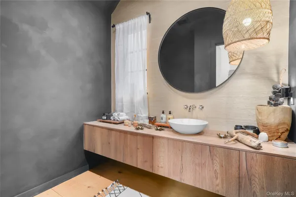 a bathroom with a sink and a mirror
