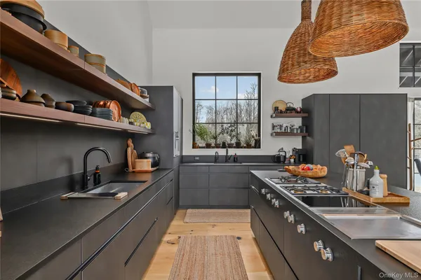 a spacious bedroom with a balcony a bed and a flat screen tv