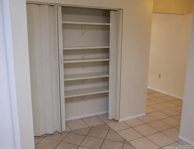 a view of an empty walk in closet