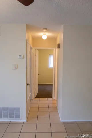 a view of a bathroom with mirror