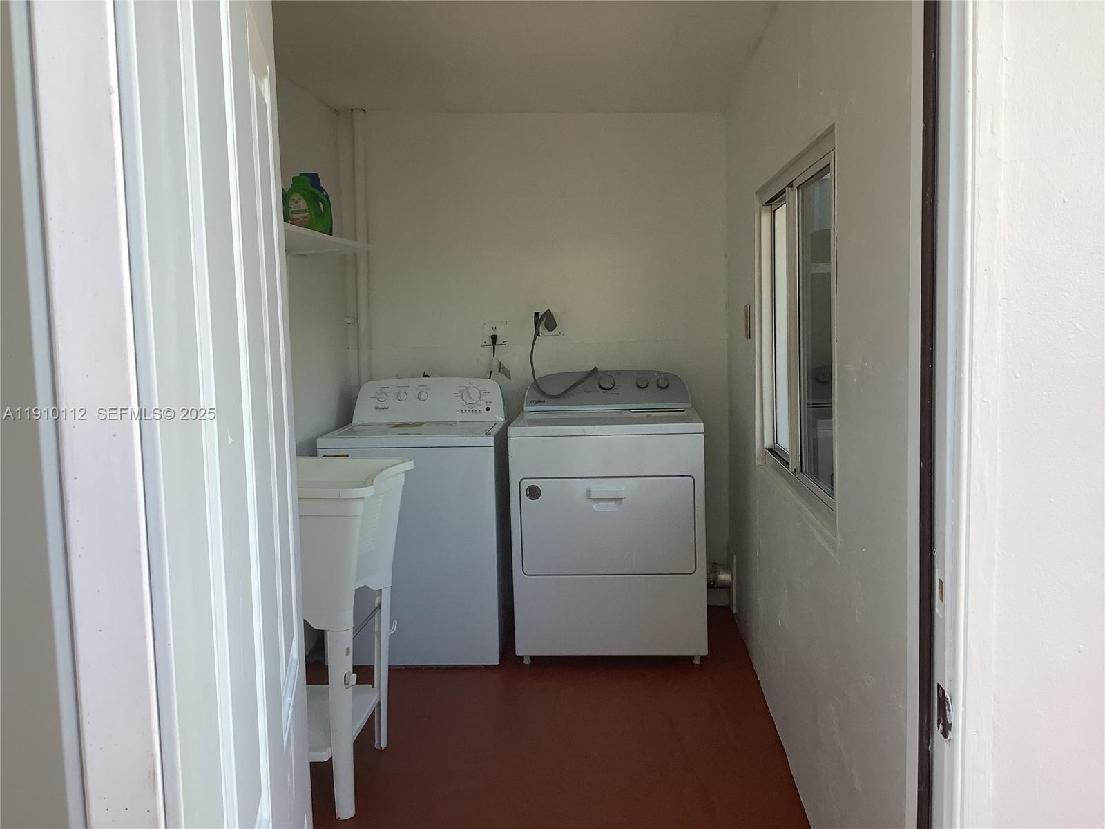 7435 Southwest 23rd Street, Unit FRONT Miami, FL 33155 - Photo 13 of 28 a utility room with dryer and washer
