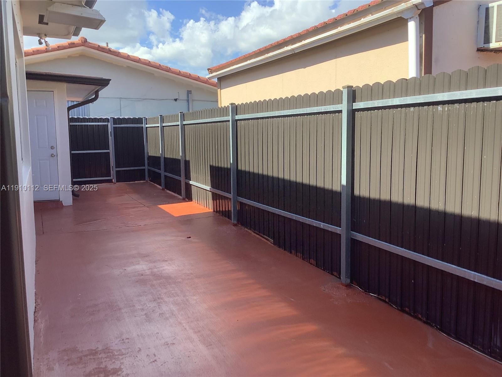 7435 Southwest 23rd Street, Unit FRONT Miami, FL 33155 - Photo 14 of 28 a view of outdoor space with wooden floor