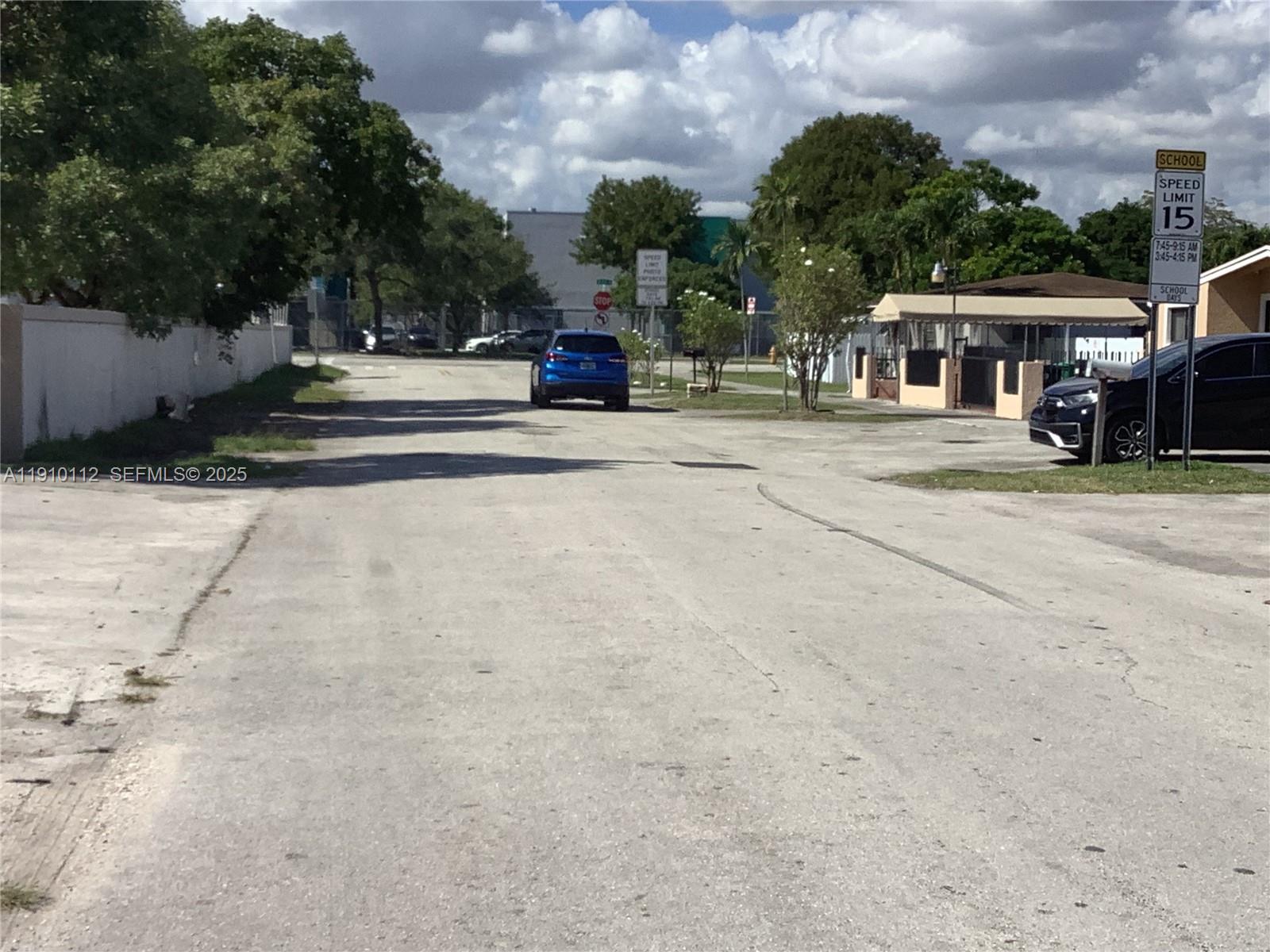 7435 Southwest 23rd Street, Unit FRONT Miami, FL 33155 - Photo 27 of 28 a view of street with houses