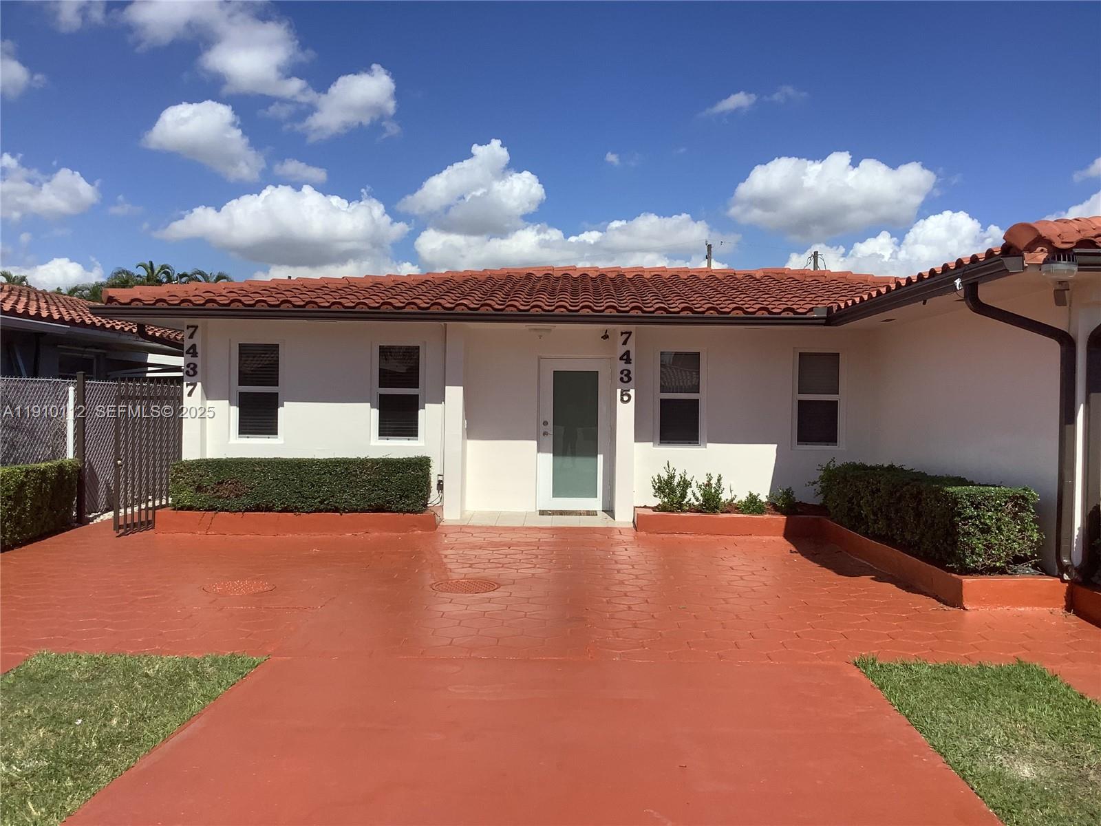7435 Southwest 23rd Street, Unit FRONT Miami, FL 33155 - Photo 28 of 28 a view of a house with a yard