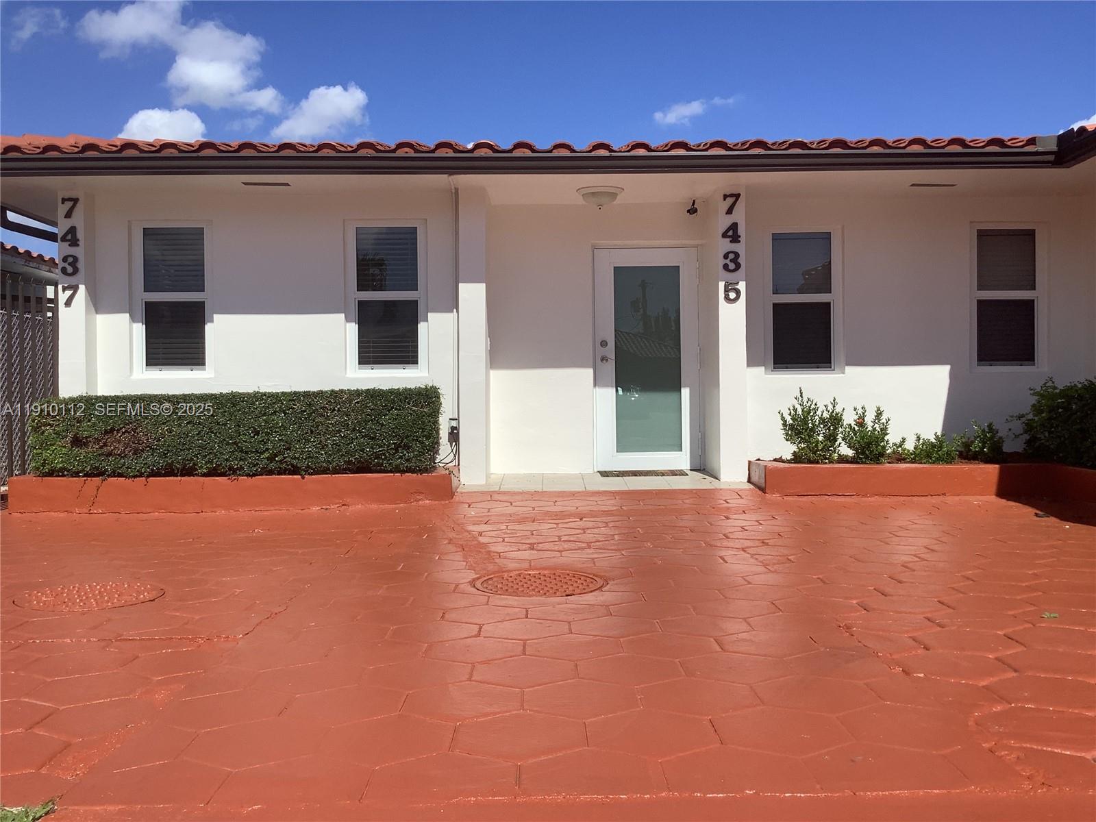 7435 Southwest 23rd Street, Unit FRONT Miami, FL 33155 - Photo 3 of 28 a view of a house with a patio