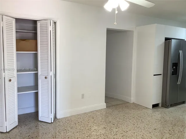 a view of an empty room with a fireplace