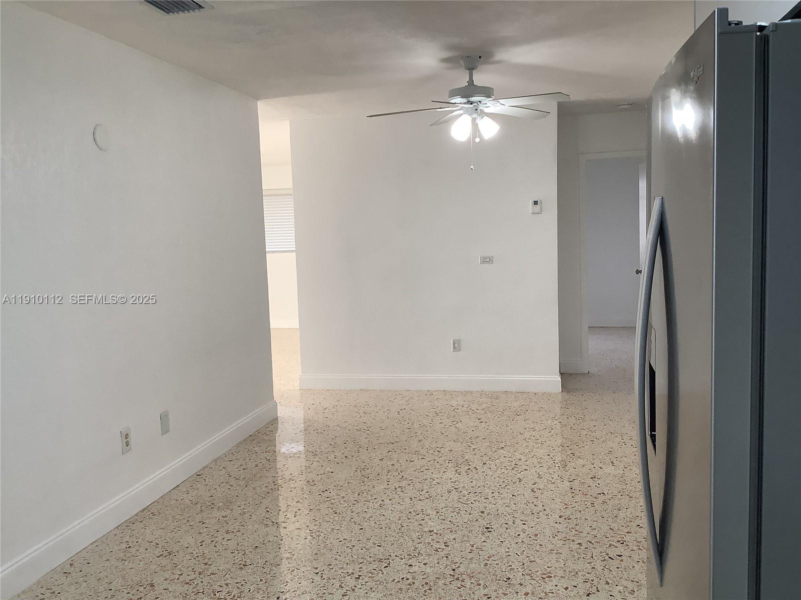 7435 Southwest 23rd Street, Unit FRONT Miami, FL 33155 - Photo 6 of 28 a view of a chandelier in a room