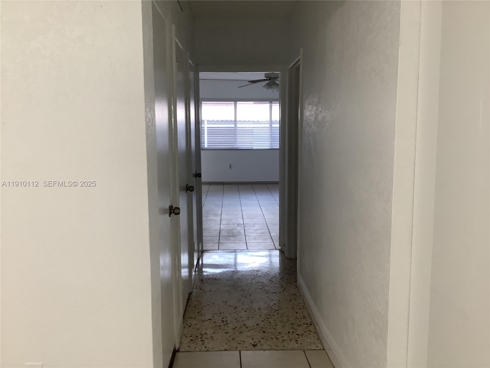 7435 Southwest 23rd Street, Unit FRONT Miami, FL 33155 - Photo 7 of 28 a view of an empty room and window