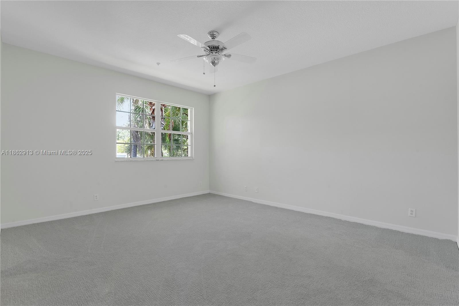 108 Lighthouse Circle, Unit E Tequesta, FL 33469 - Photo 16 of 34 an empty room with a window