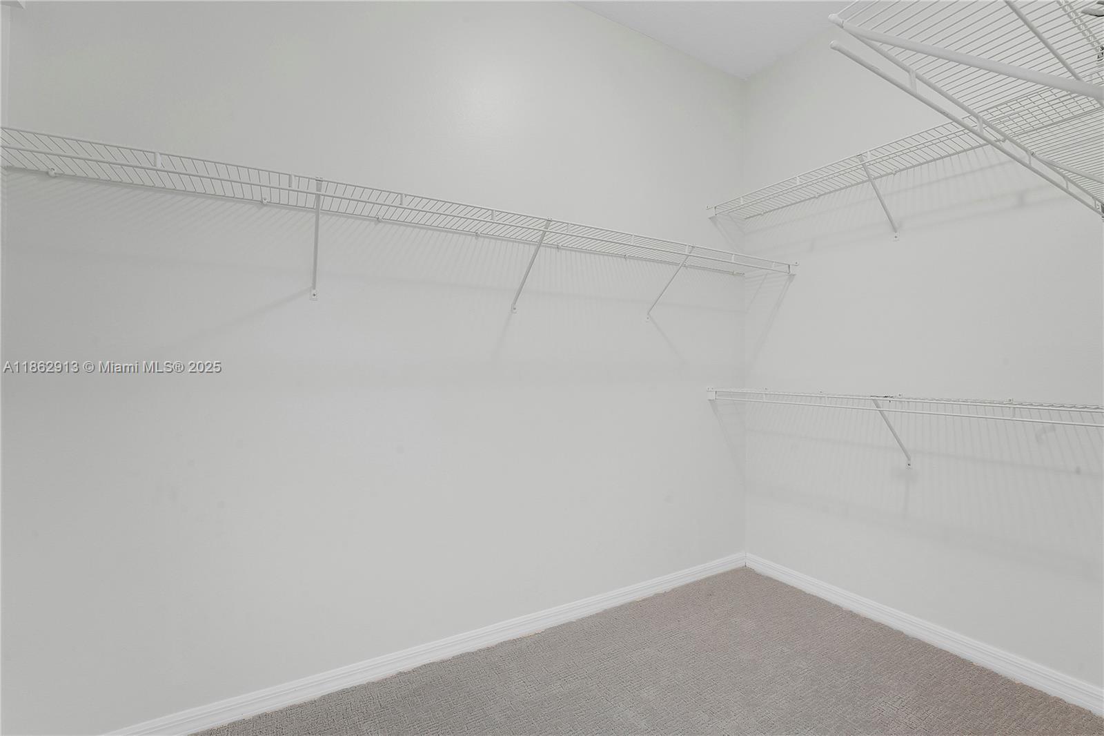 108 Lighthouse Circle, Unit E Tequesta, FL 33469 - Photo 20 of 34 a view of a room with racks on the wall