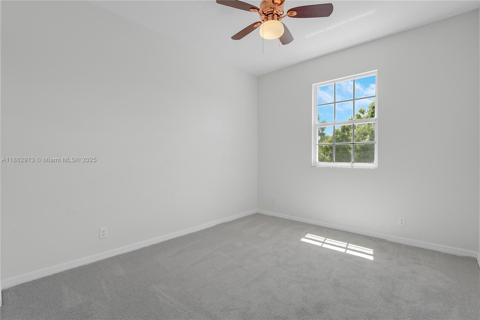 108 Lighthouse Circle, Unit E Tequesta, FL 33469 - Photo 25 of 34 an empty room with a window