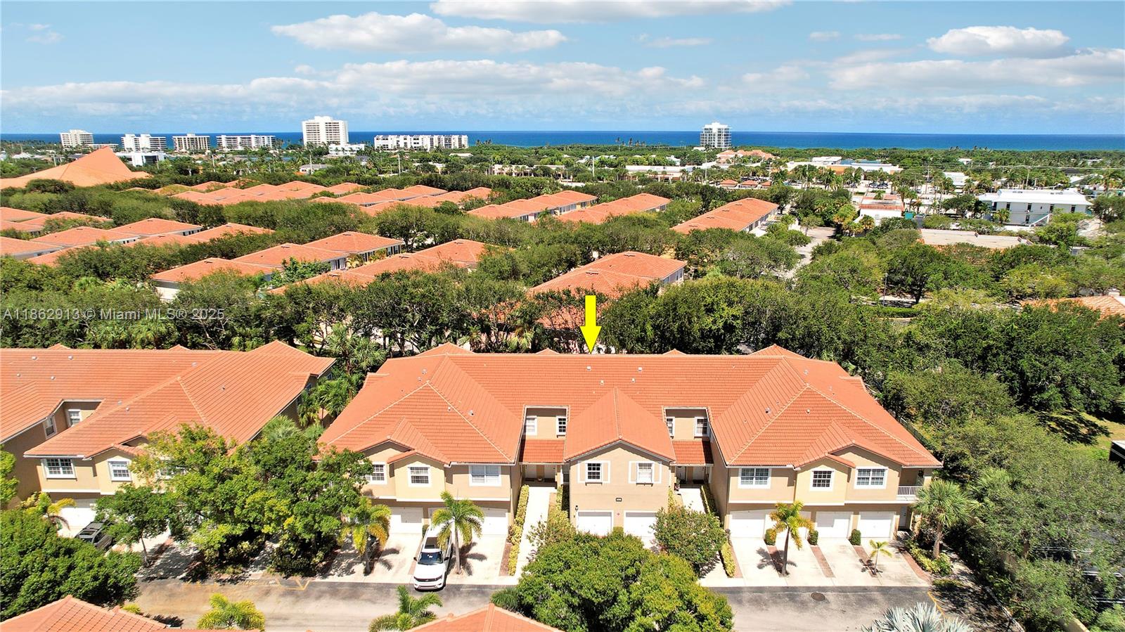 108 Lighthouse Circle, Unit E Tequesta, FL 33469 - Photo 30 of 34 an aerial view of residential houses with outdoor space