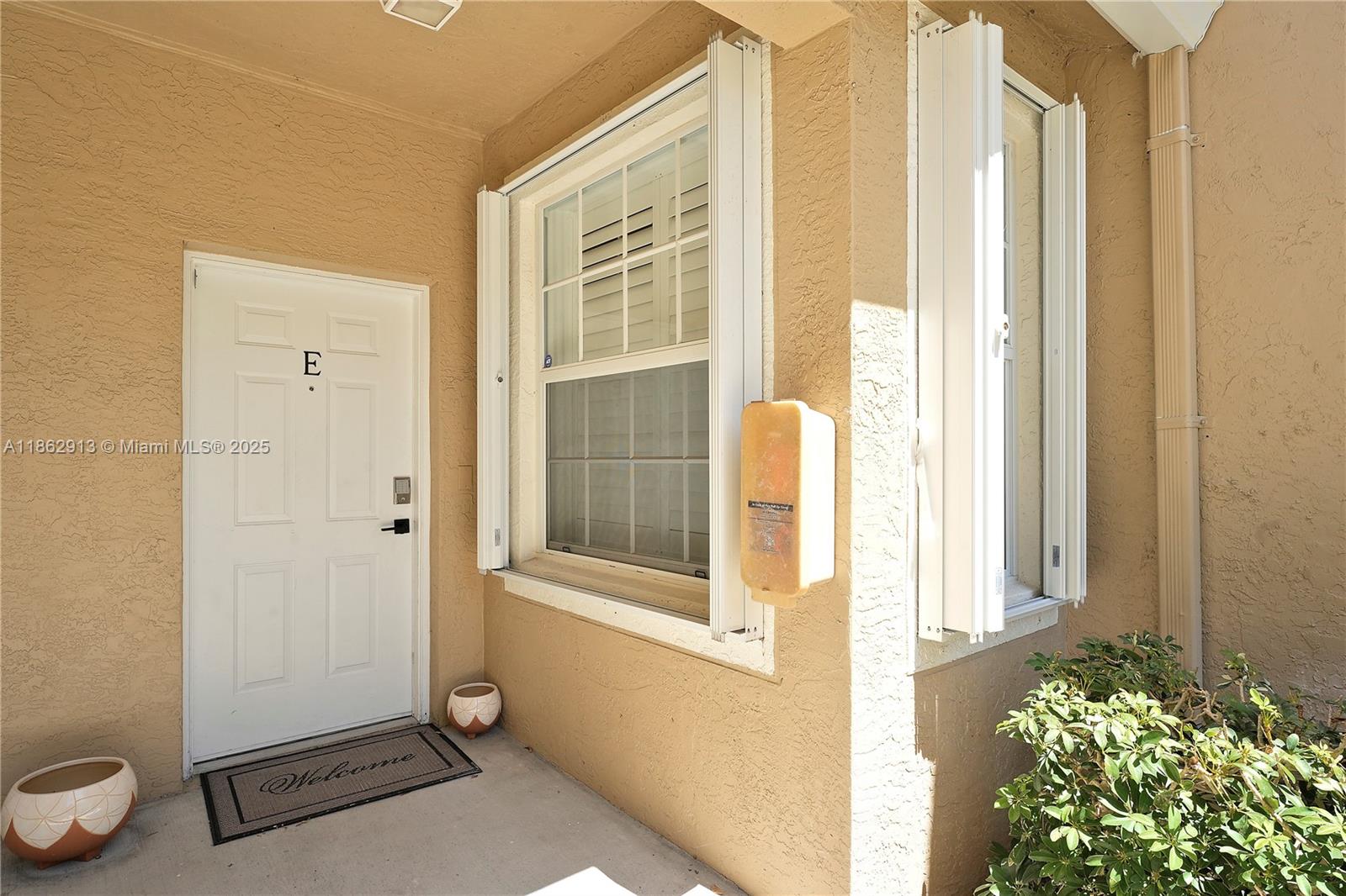 108 Lighthouse Circle, Unit E Tequesta, FL 33469 - Photo 3 of 34 a view of a door and wooden floor