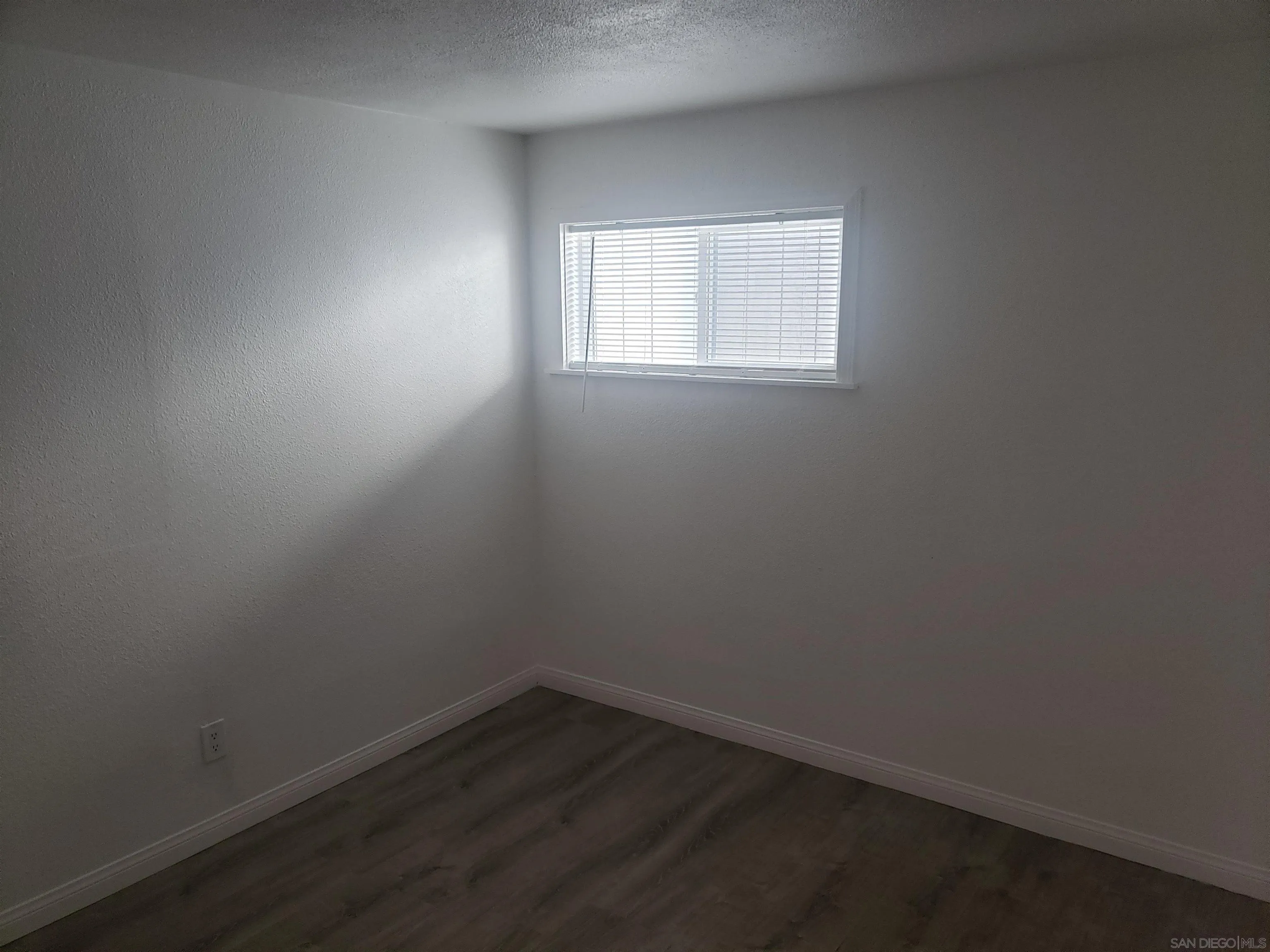 1207-9 Lyons Lane El Cajon, CA 92021 - Photo 14 of 39 an empty room with a window