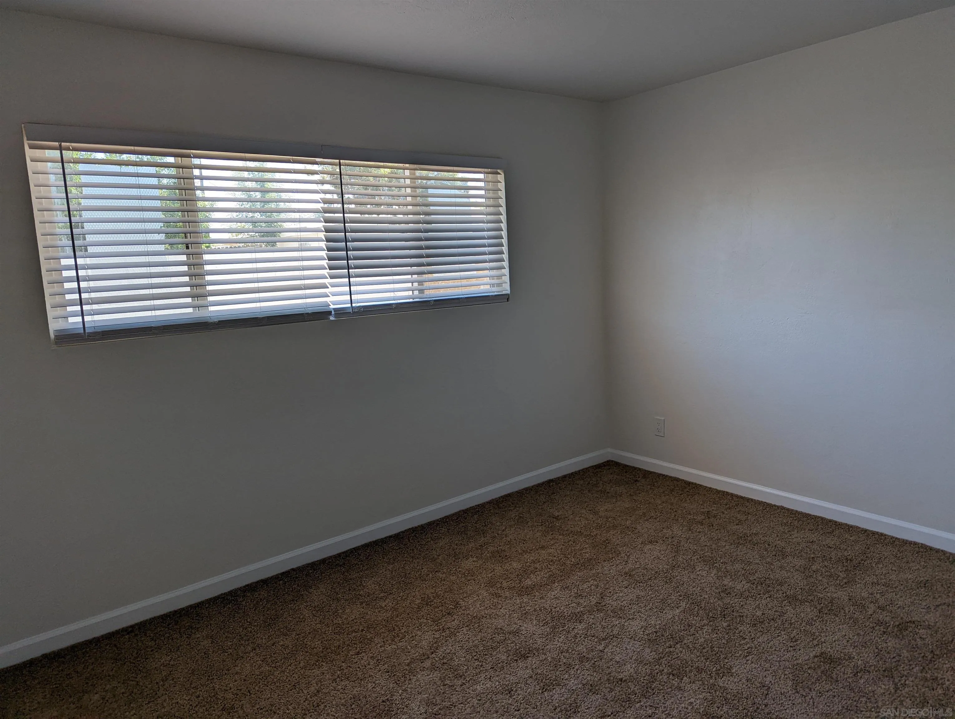 1207-9 Lyons Lane El Cajon, CA 92021 - Photo 19 of 39 an empty room with a window