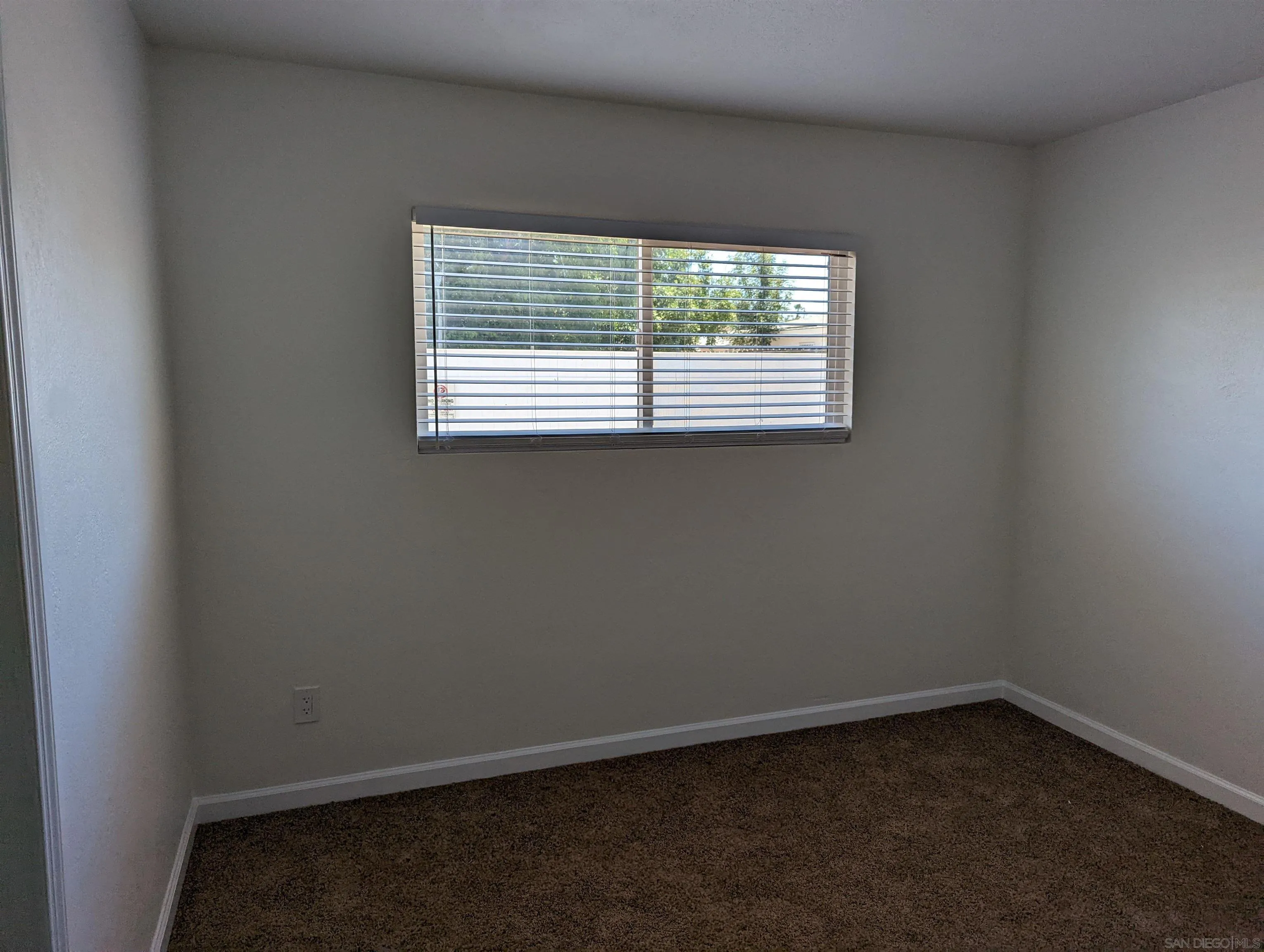 1207-9 Lyons Lane El Cajon, CA 92021 - Photo 20 of 39 an empty room with a window