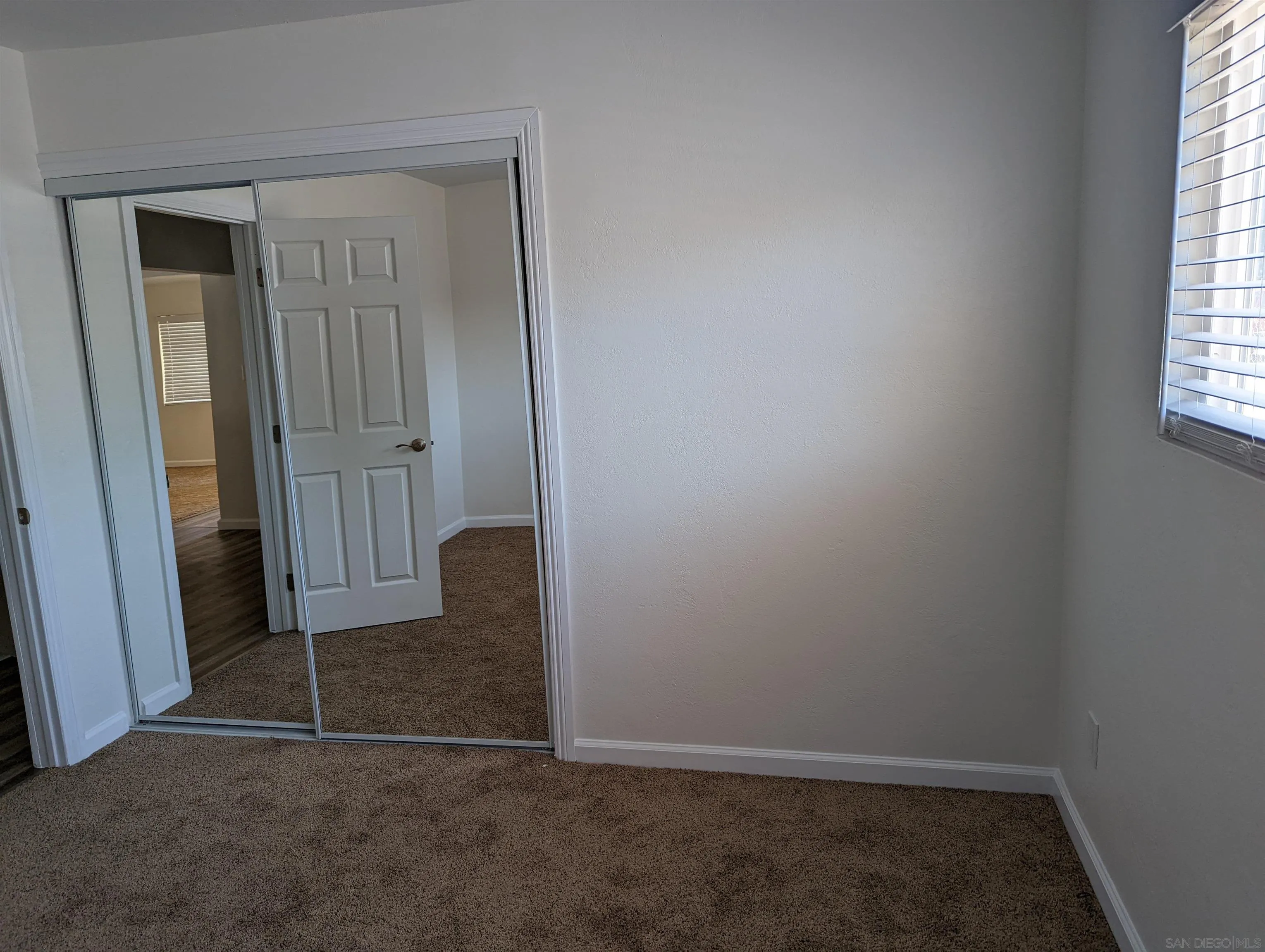 1207-9 Lyons Lane El Cajon, CA 92021 - Photo 32 of 39 an empty room with windows