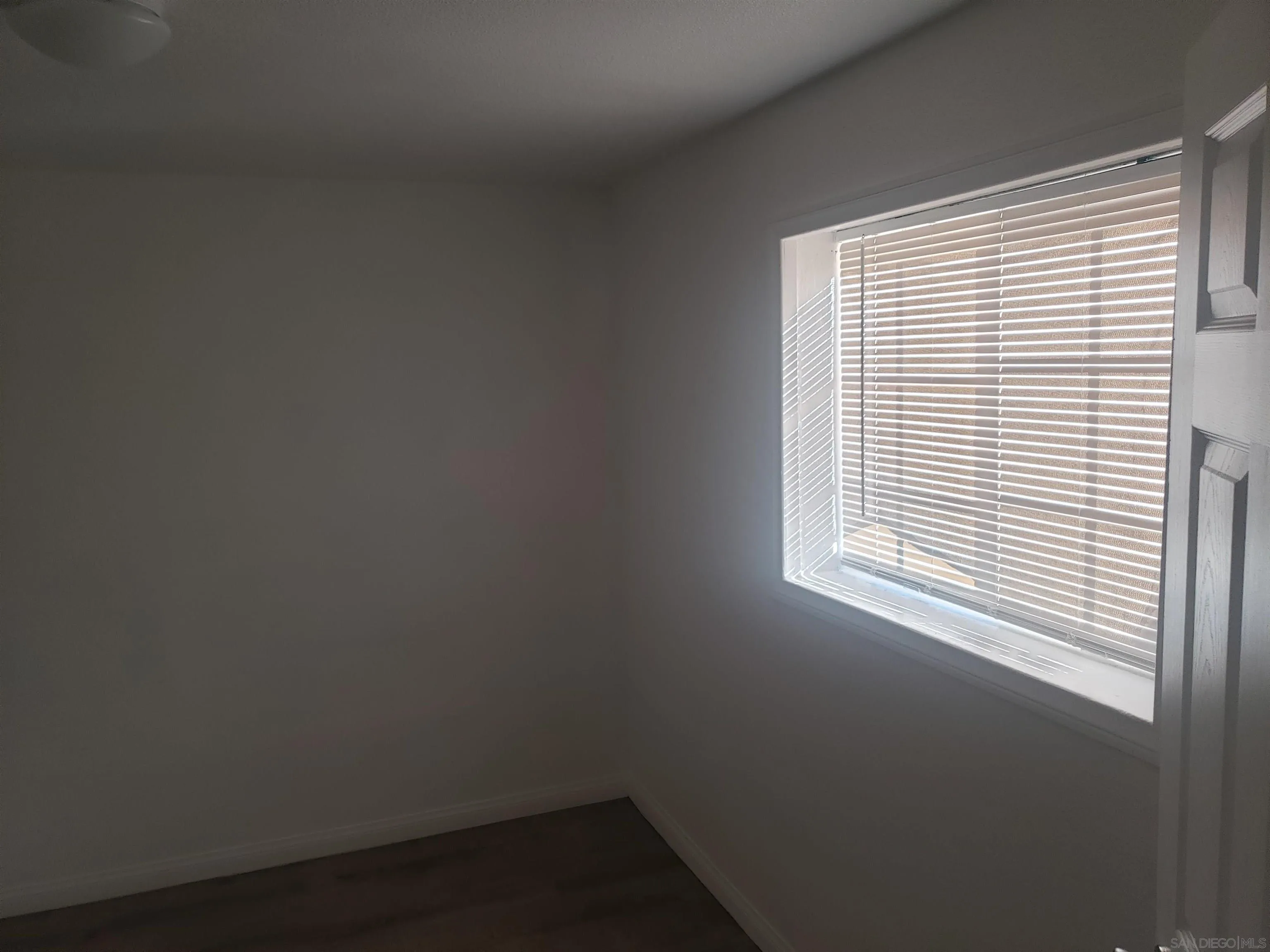 1207-9 Lyons Lane El Cajon, CA 92021 - Photo 33 of 39 an empty room with a window