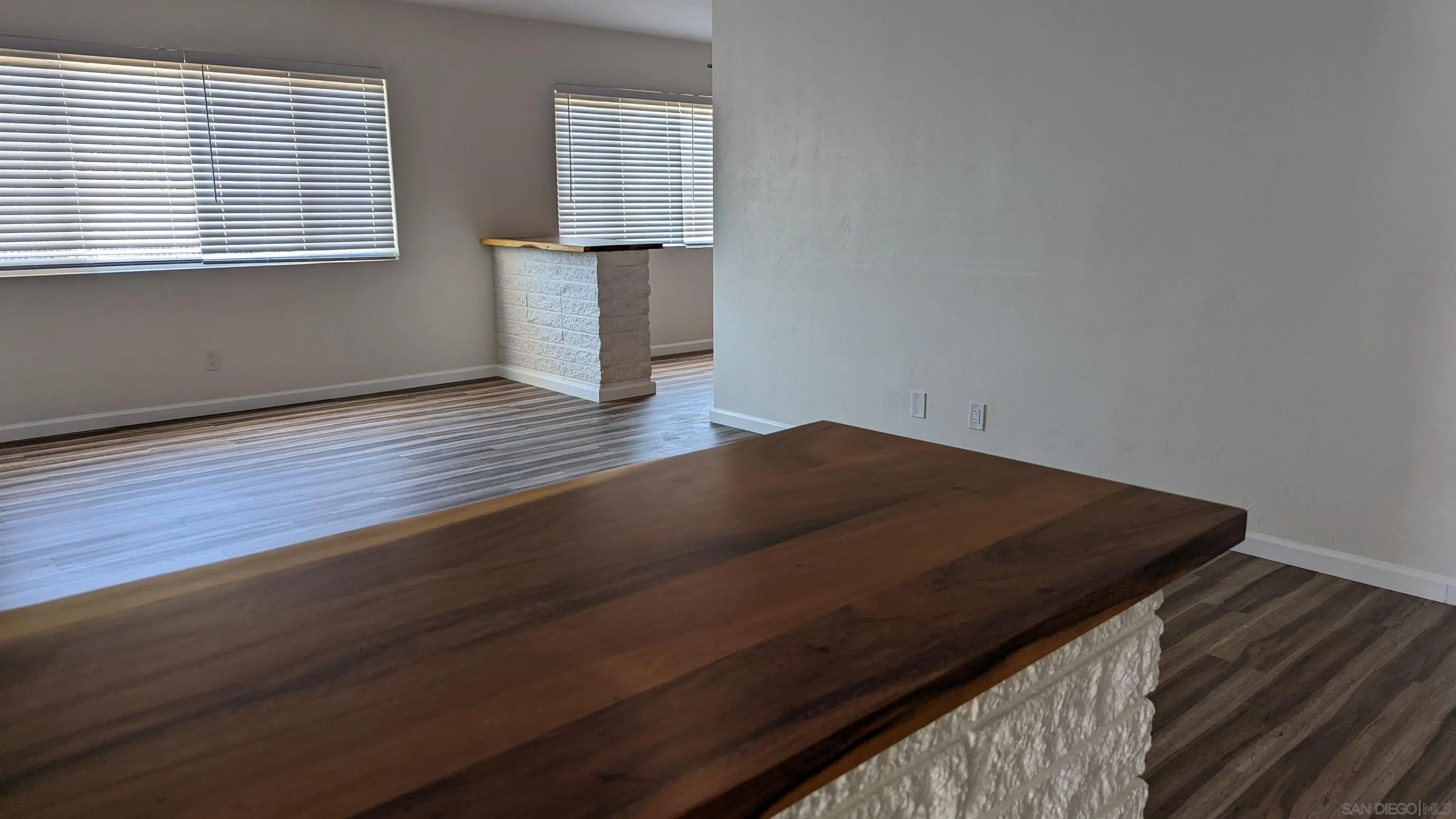 1207-9 Lyons Lane El Cajon, CA 92021 - Photo 37 of 39 an empty room with wooden floor