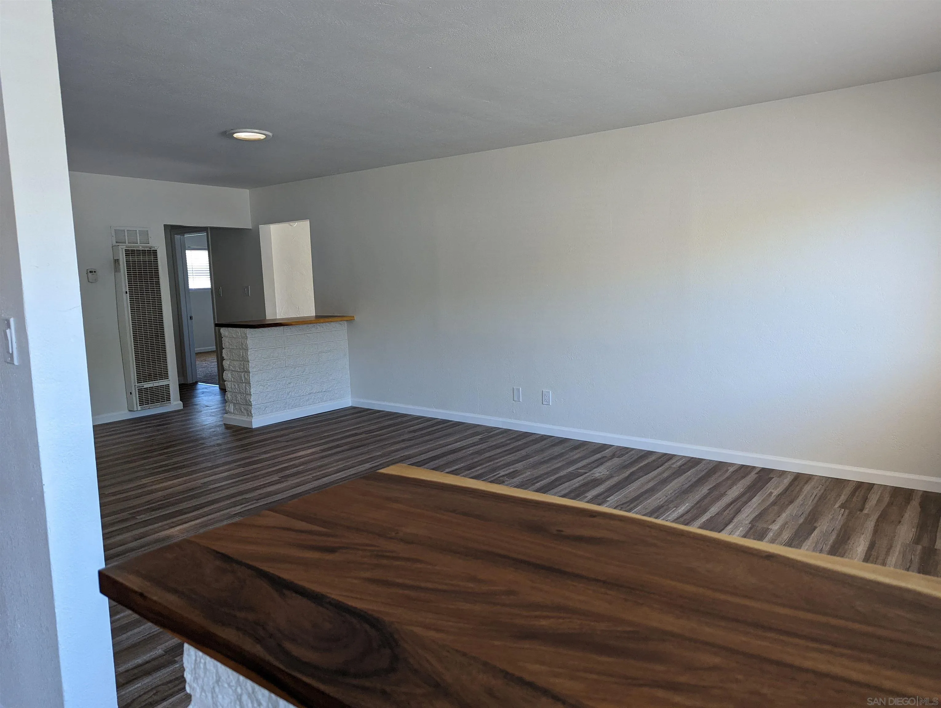 1207-9 Lyons Lane El Cajon, CA 92021 - Photo 9 of 39 a view of wooden floor and staircase