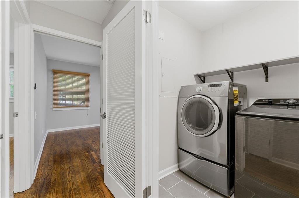 1063 Seville Drive Clarkston, GA 30021 - Photo 13 of 25 a view of a hallway with washer and dryer