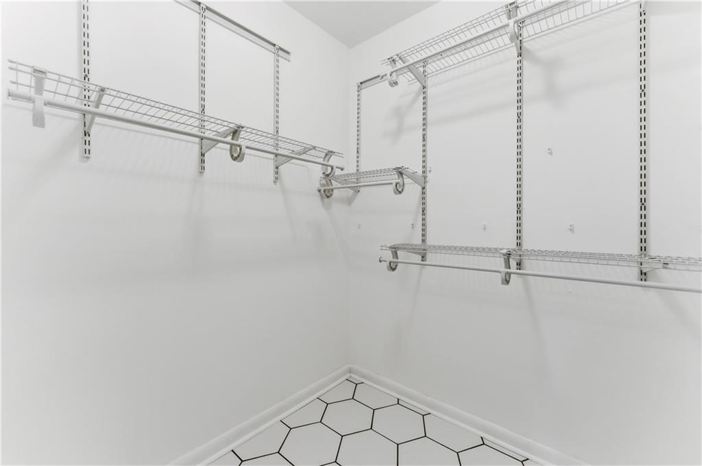1063 Seville Drive Clarkston, GA 30021 - Photo 20 of 25 a view of a room with racks on the wall