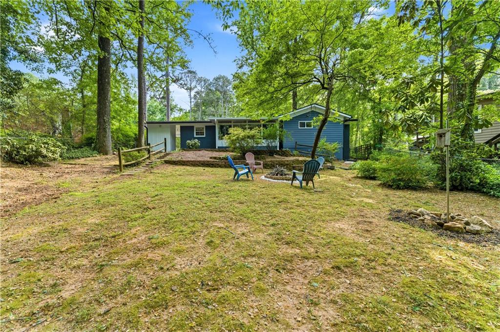 1063 Seville Drive Clarkston, GA 30021 - Photo 24 of 25 a view of a house with backyard and sitting area
