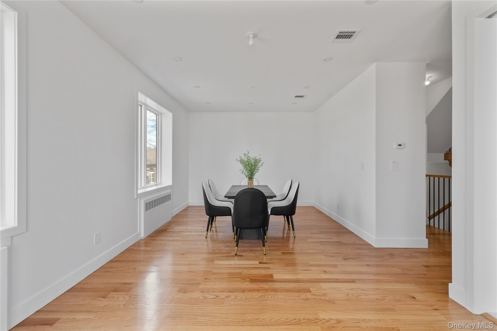 236 Old Nyack Turnpike, Unit 202 Spring Valley, NY 10977 - Photo 16 of 49 a view of a dining room with furniture and wooden floor