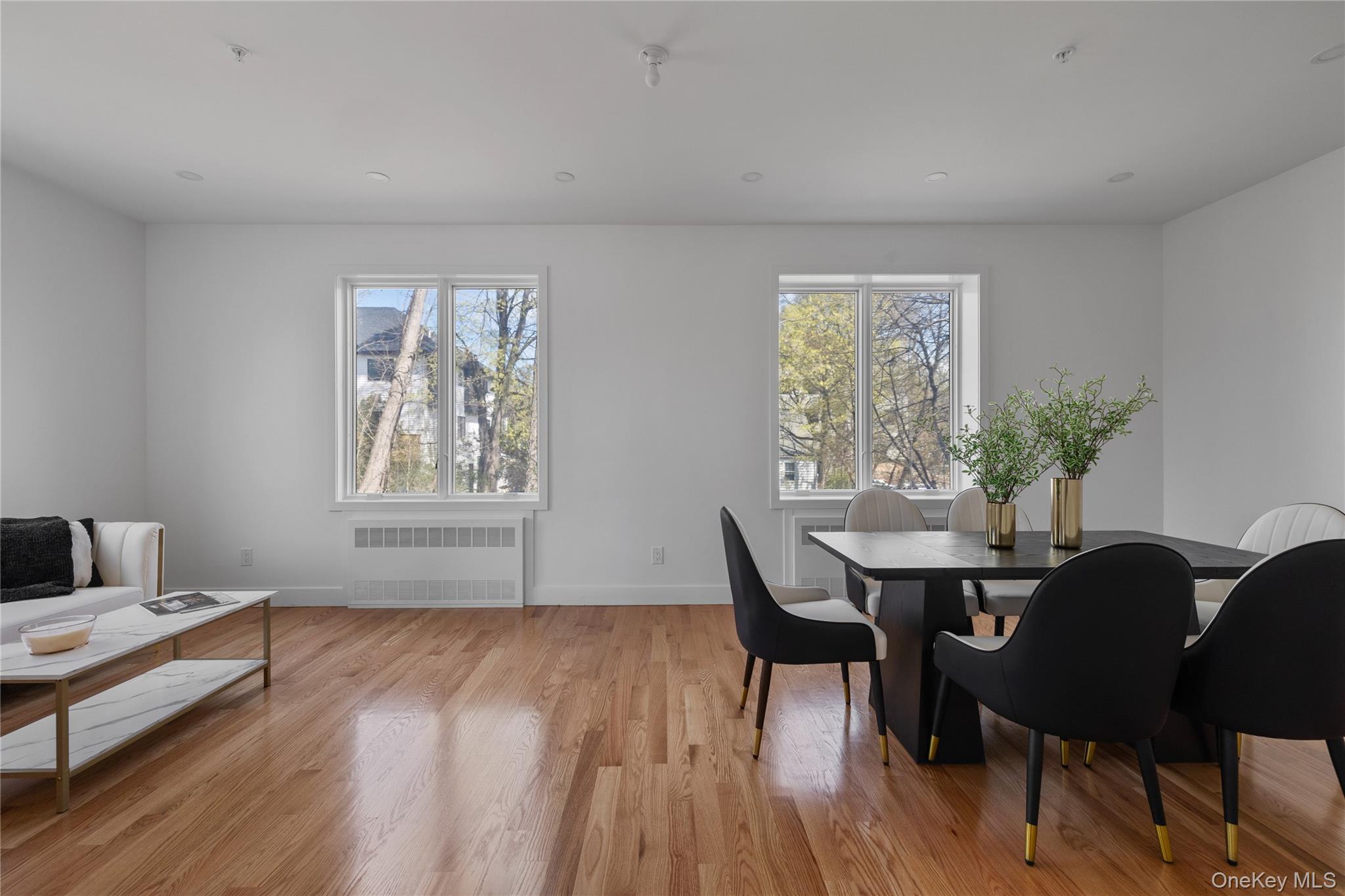 236 Old Nyack Turnpike, Unit 202 Spring Valley, NY 10977 - Photo 19 of 49 a view of a dining room with furniture and wooden floor