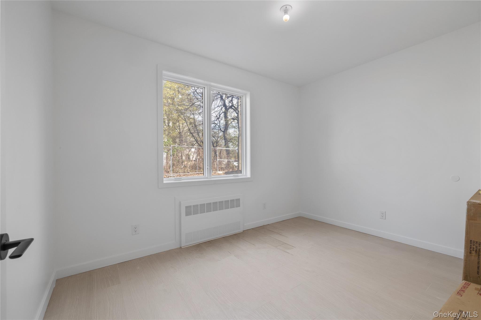 236 Old Nyack Turnpike, Unit 202 Spring Valley, NY 10977 - Photo 44 of 49 an empty room with a window