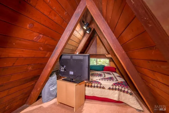 a view of a chairs and table on the wooden deck