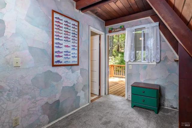 wooden floor in a livingroom with a window
