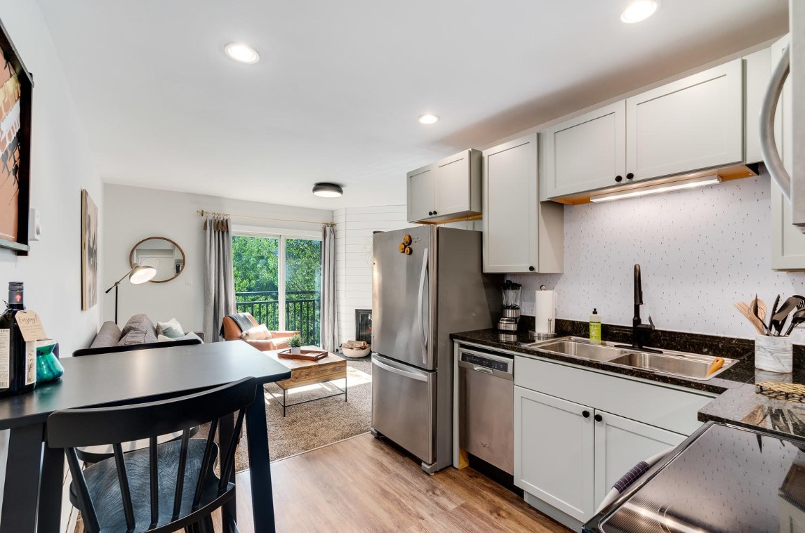 401 South Ridge Street, Unit 21 Breckenridge, CO 80424 - Photo 5 of 12 a kitchen with refrigerator cabinets and wooden floor