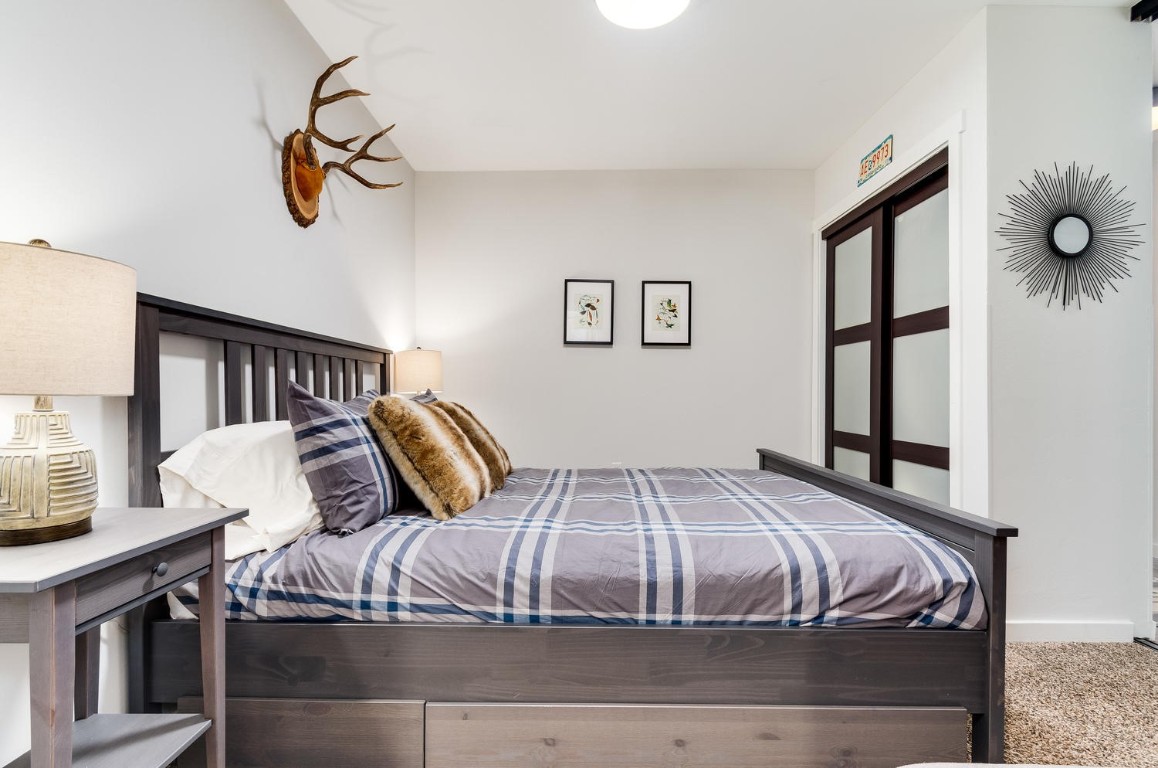 401 South Ridge Street, Unit 21 Breckenridge, CO 80424 - Photo 8 of 12 a bedroom with a bed and window