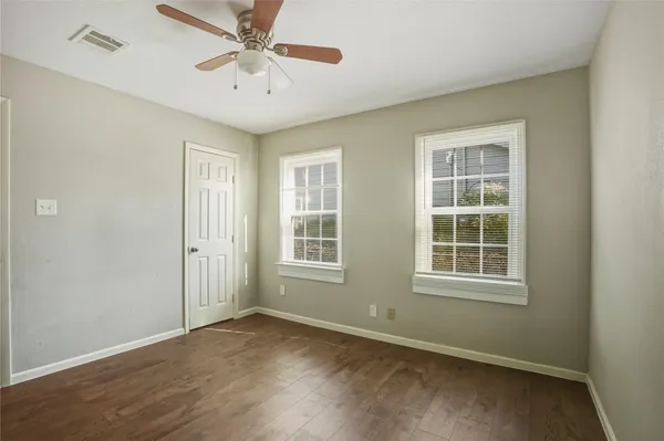 a front view of a house with a garden and porch
