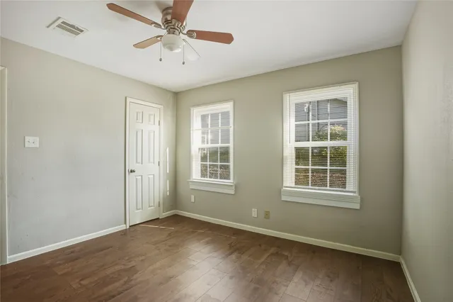 a front view of a house with a garden and porch