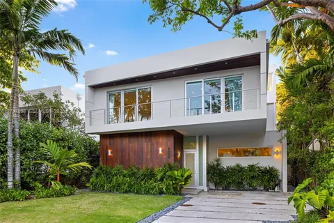 a view of dining room with furniture and floor to ceiling window
