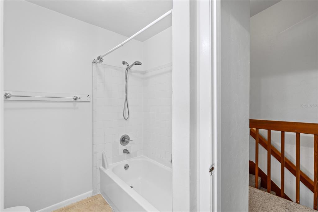 2219 Southwest 39th Way Gainesville, FL 32607 - Photo 9 of 17 a bathroom with a bathtub and a shower