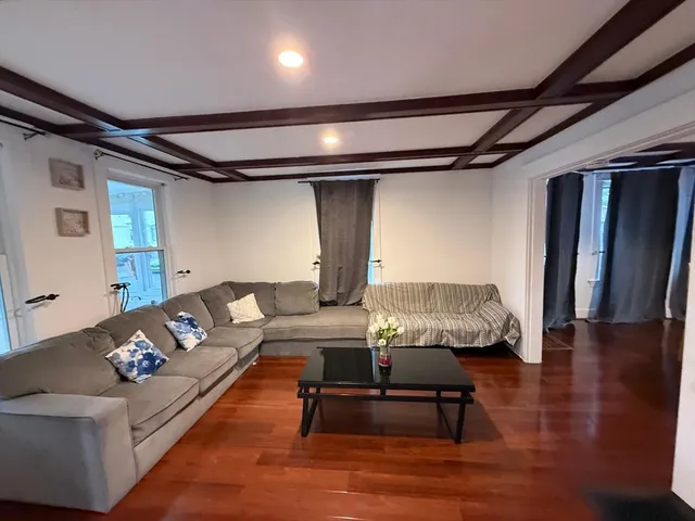 a living room with furniture and a table