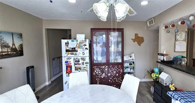 a living room with lots of furniture and chandelier