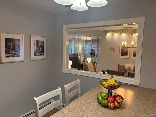 a room with wooden floor and outdoor seating