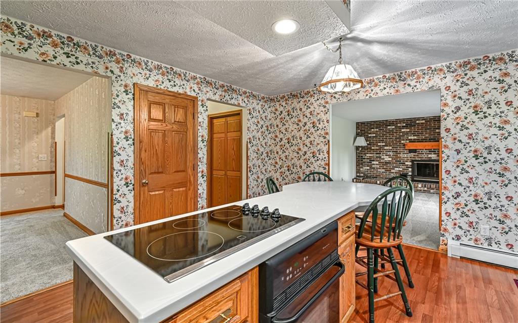 230 Election House Road Butler, PA 16001 - Photo 13 of 38 a kitchen with a sink a counter and chairs