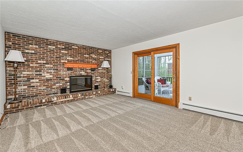 230 Election House Road Butler, PA 16001 - Photo 14 of 38 a view of an empty room with furniture and a fireplace