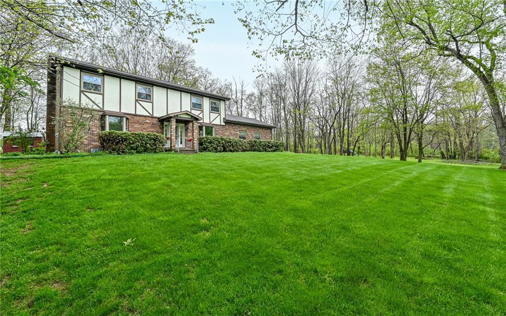230 Election House Road Butler, PA 16001 - Photo 2 of 38 a front view of a house with a yard and trees