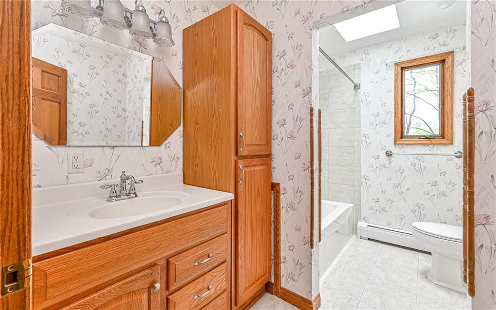 230 Election House Road Butler, PA 16001 - Photo 22 of 38 a bathroom with a sink a mirror and a shower