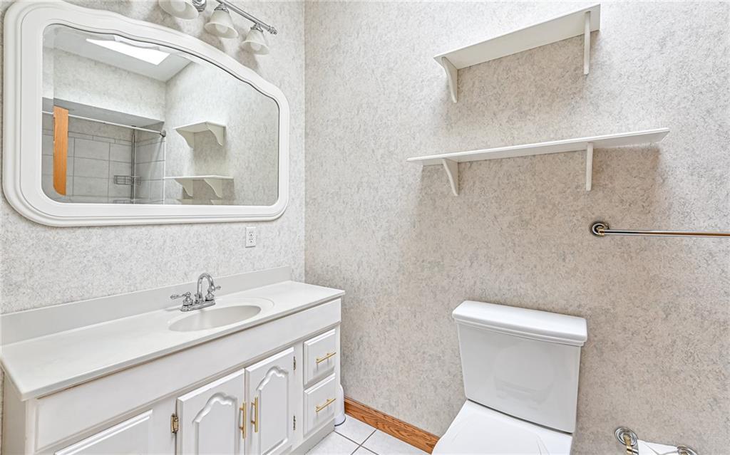 230 Election House Road Butler, PA 16001 - Photo 25 of 38 a bathroom with a sink a mirror and a toilet