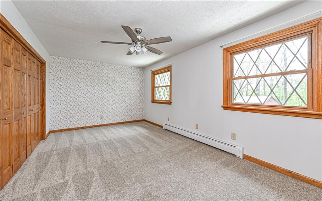 230 Election House Road Butler, PA 16001 - Photo 27 of 38 wooden floor in an empty room with a window